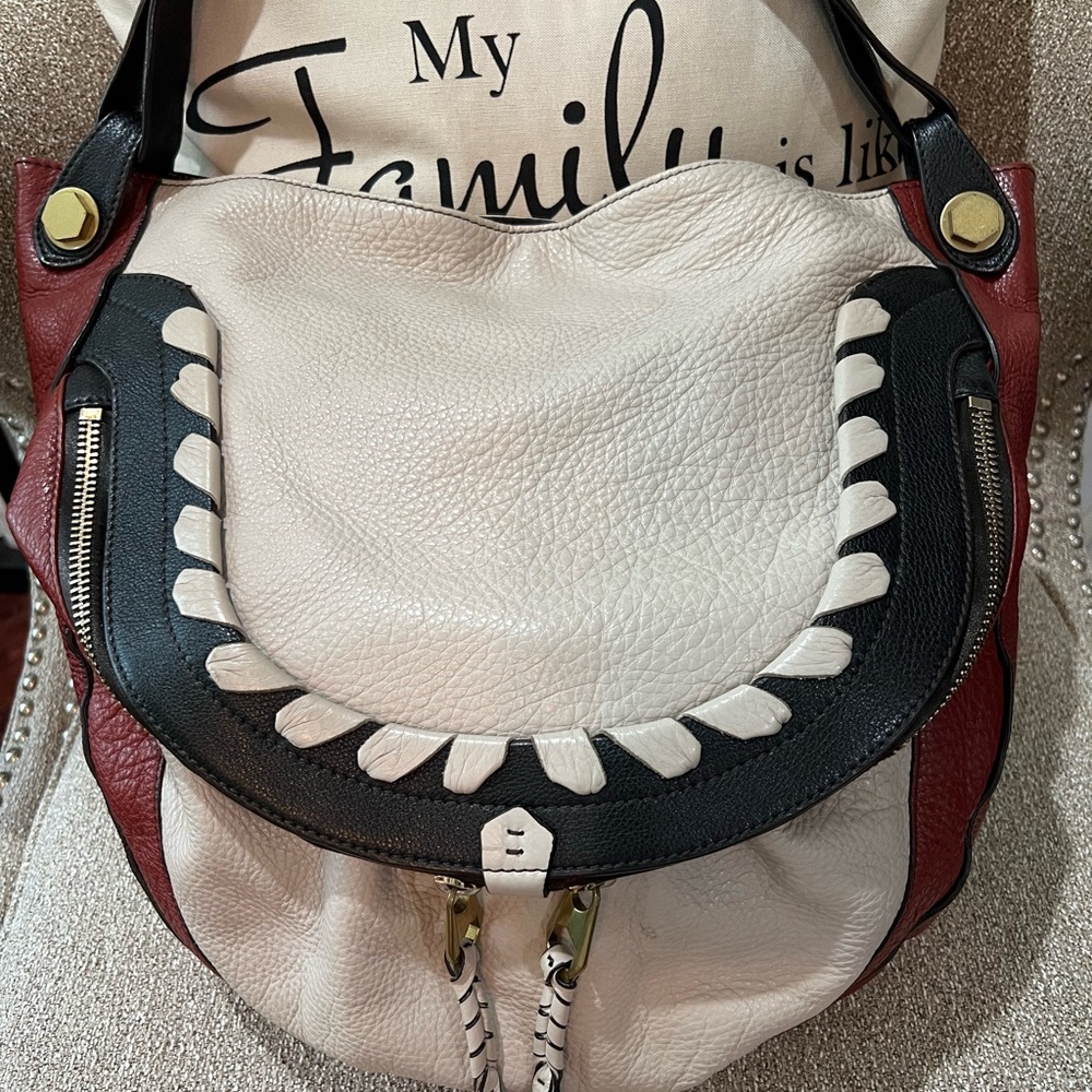 OrYANY Red and White Leather Hobo Bag with Style and Functionality.